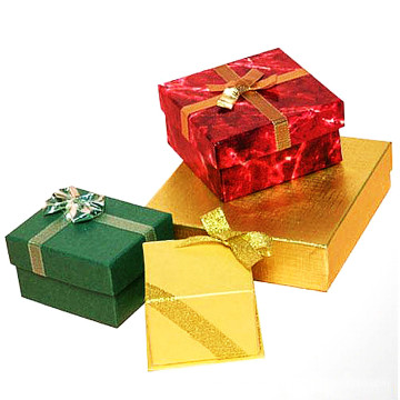 Cajas de papel con cruz de oro de la cinta